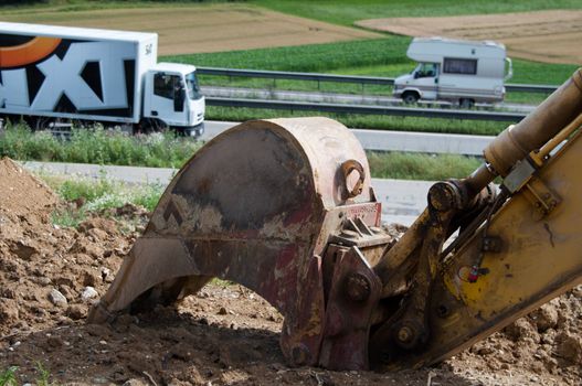 ZUSMARSHAUSEN, GERMANY – JULY 15: Construction site of the extension of A8 highway from currently 4 to 6 lanes at Zusmarshausen, Germany on July 15, 2012. Heavy machinery is used for this massive project happening in a timeframe of over 2 years.