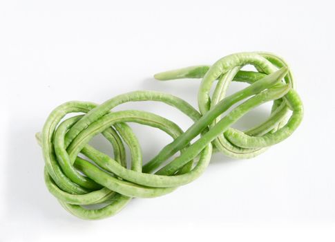 a bunch of fresh cow pea on white background
