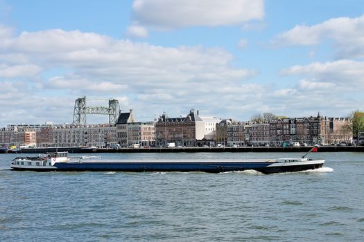 Barge on  backdrop of  waterfront of Rotterdam. Netherlands 