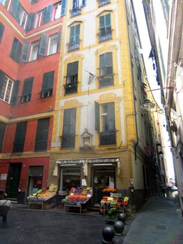 Square with a fruit and vegetables store in Genoa                          