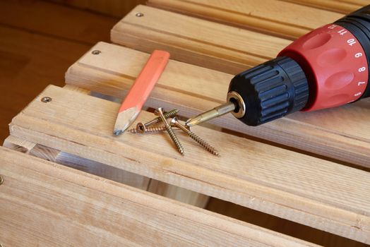 Power Tool Drilling Down a Screw into Wood