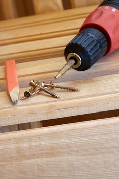 Power Tool Drilling Down a Screw into Wood