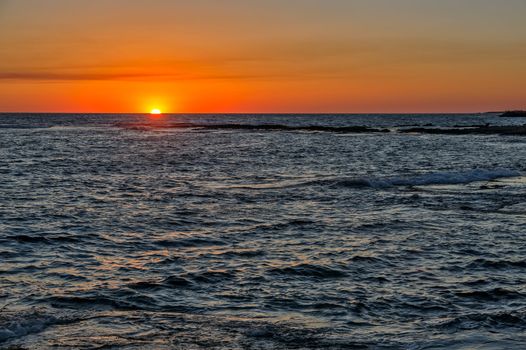 Sun down under horizon over the sea