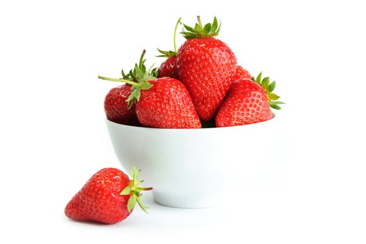 An image of bright red strawberries in a white cup