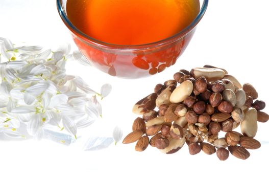 An image of petal, nuts and honey