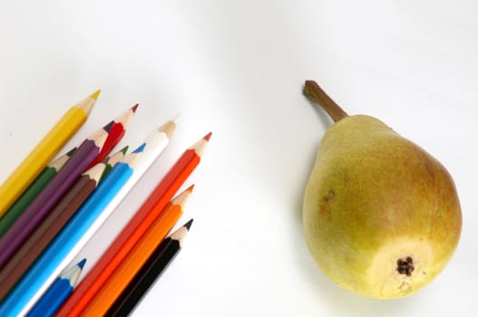 An image of pencils with pear on background