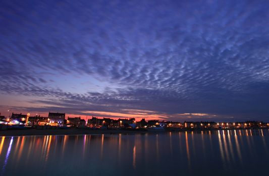 Mackrel sky over Weymouth seafront at dusk in dorset england