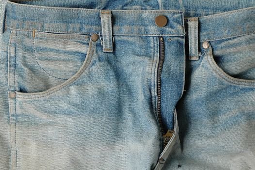 Closeup of blue denim jeans pockets. 