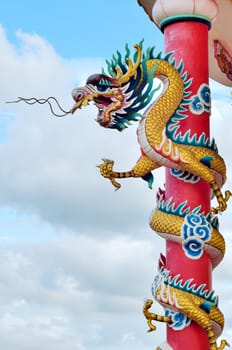 Dragon sculpture rounded the red column