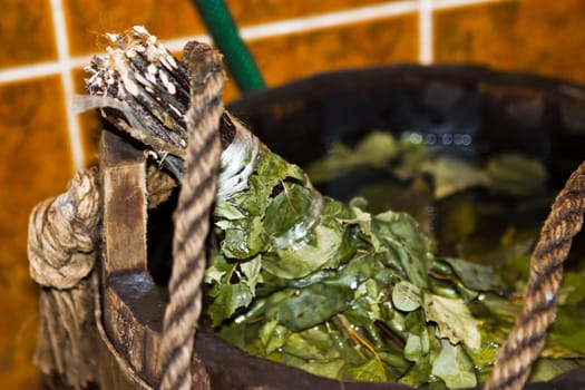 wooden bucket with broom