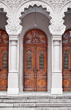 Ancient wooden doors - the entrance to the temple