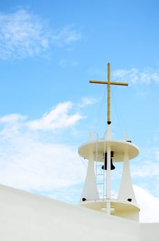 Bell tower with cross at church