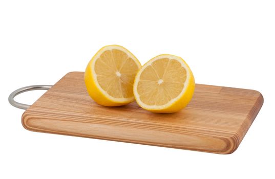 Two halves cut lemon on cutting board isolated on white background.