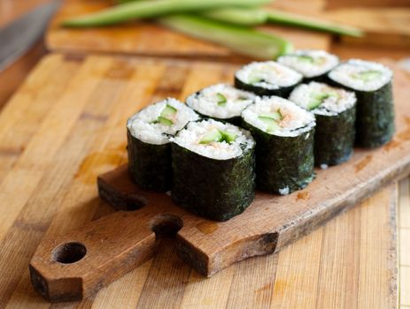 An image of rolls on wooden plate