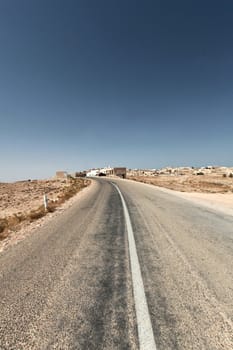 Deserted highway through the desert in Tunisia