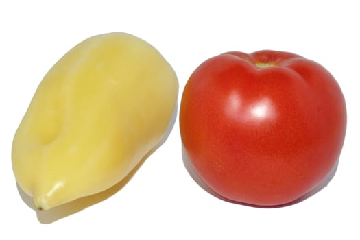 Yellow sweet pepper and red tomato on a white background