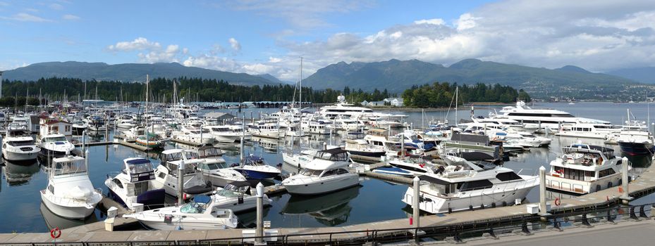 Many variety of yachts moored in a marina near Stanley park in Vancouver BC., Canada.