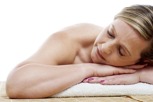 Cropped image of woman relaxing at spa centre isolated on white background