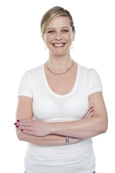 Caucasian woman posing with arms crossed isolated against white background
