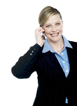 Cropped image of a businesswoman communicating on cell phone isolated over white