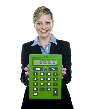 Businesswoman showing big green calculator against white background