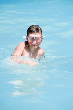 Young boy diving in the water