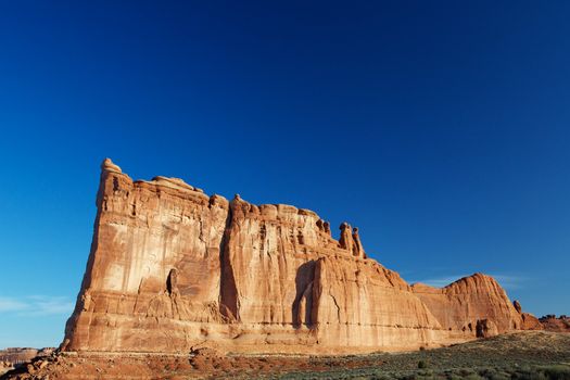 Courthouse Towers Ridge in Arches National Park with dramatic Blue Sky