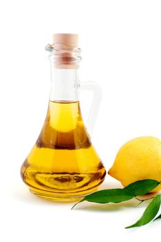An image of a bottle of olive oil and lemon