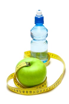Green apple and bottle with water