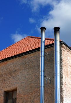 Metal round pipes of a heater in the house