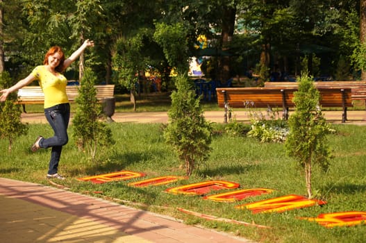 The young cheerful girl on walk