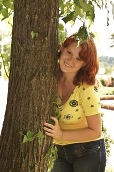 The young cheerful girl on walk