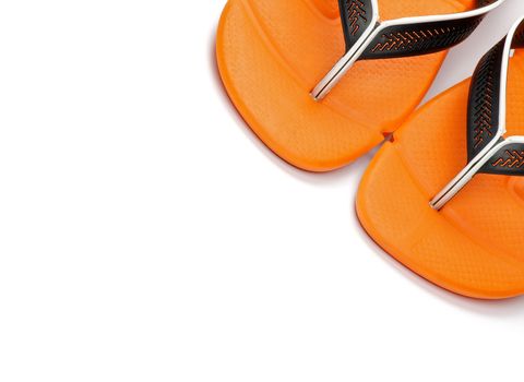 Pair of Orange Beach Sandals close up on white background