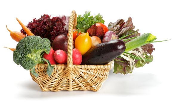 Basket of Various Vegetables with Broccoli, radishes, lettuce, onions, leeks, beets, carrots, red tomatoes, yellow tomatoes, parsley isolated on white background