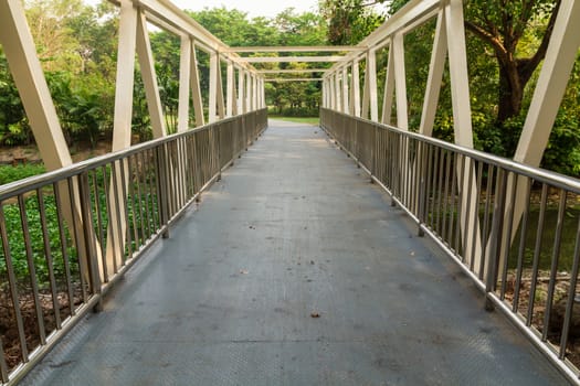 Bridge over the river to a park in Bangkok, Thailand.