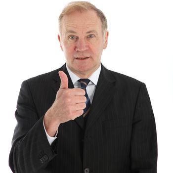 Elderly businessman giving a thumbs up gesture of agreement and approval isolated on white 