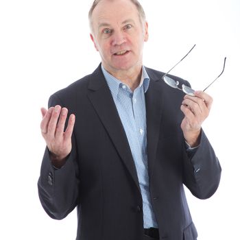 Dogmatic businessman with wide eyes and gesturing hands getting his point across isolated on white 