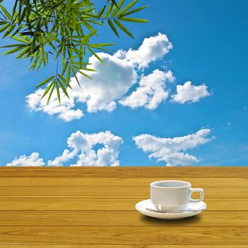 Hot coffee on table with nice blue sky