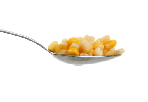 Spoon with corn on a white background