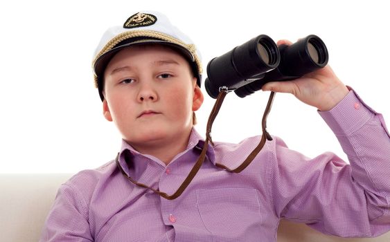 Strict boy with glasses and a cap Captain