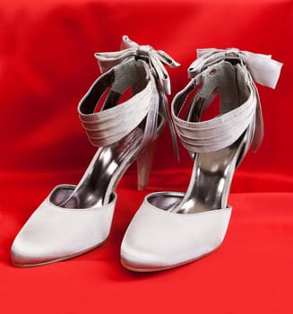 Pair of white women's shoes on a white background