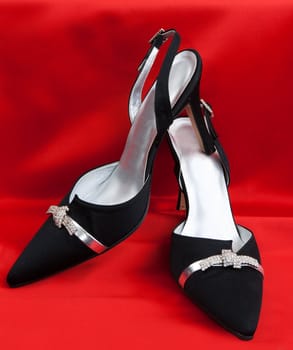 Pair of black women's shoes on a white background
