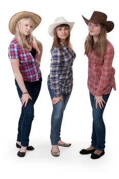 Three girls in hats on white background