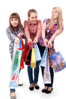 Three girls with colorful shopping bags on white background