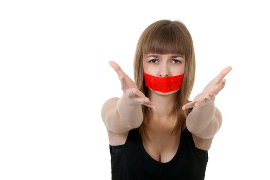 beautiful girl with her mouth sealed with red tape