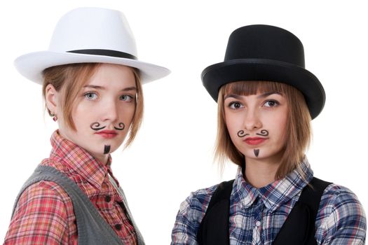 Two girls with painted mustaches and bowler hats on white background
