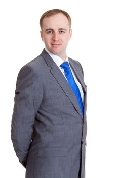 Portrait of a businessman in a gray suit and blue tie