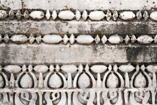 Carved patterns in the old white marble