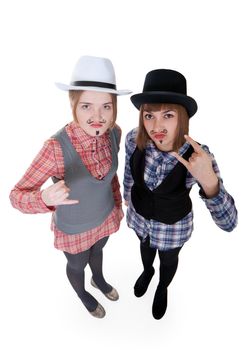 Two girls with painted mustaches and bowler hats on white background