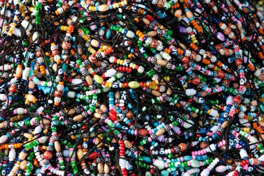Bracelets with dice, and amulets in the heap